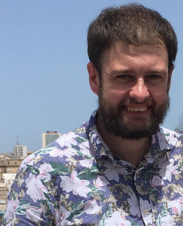 Portrait of Gavin David Shepherd in a flowerr shirt