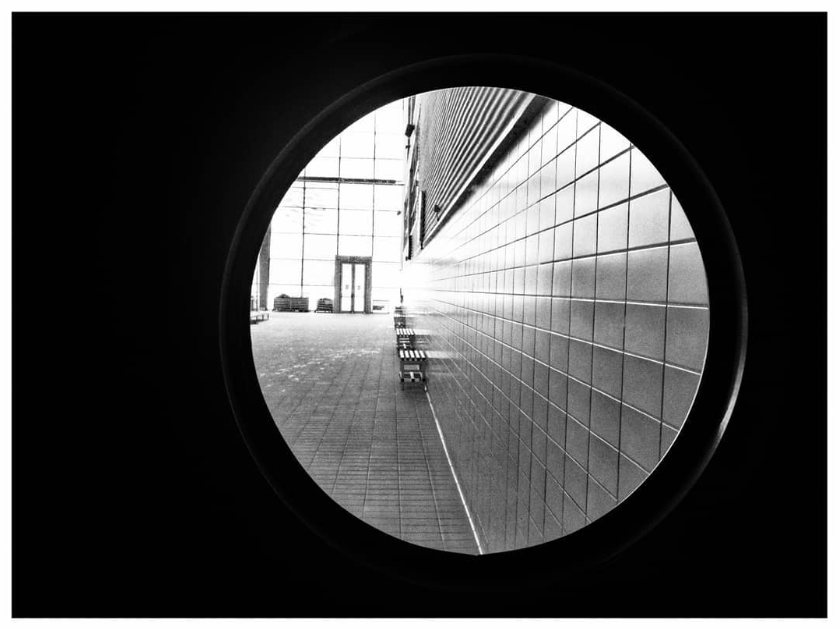Picture of an outer wall seen through a circular window